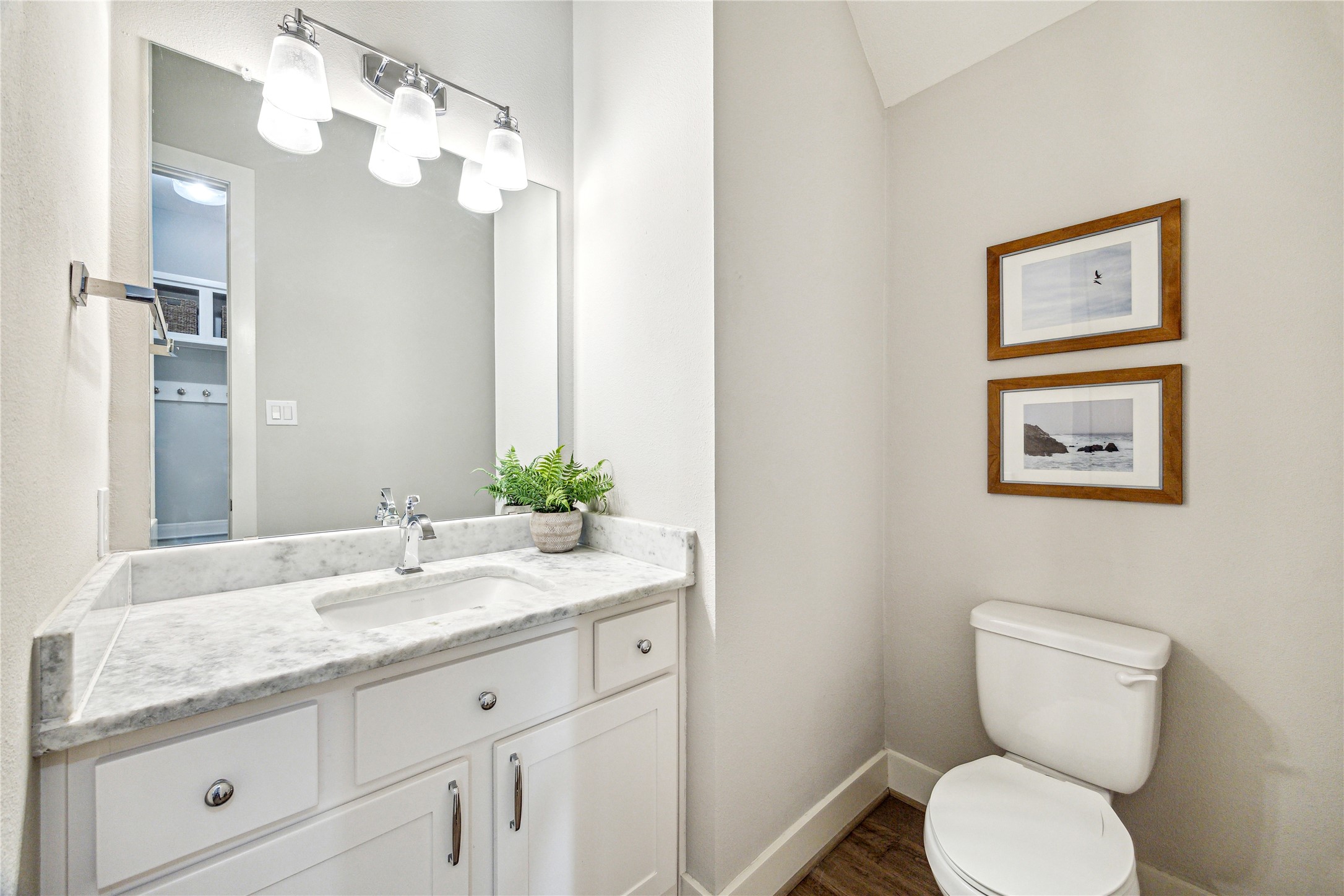 603 Vincent Street Houston, TX 77009 - Photo 14 of 26 The first floor powder bath is privately, yet conveniently tucked away near the mud room.