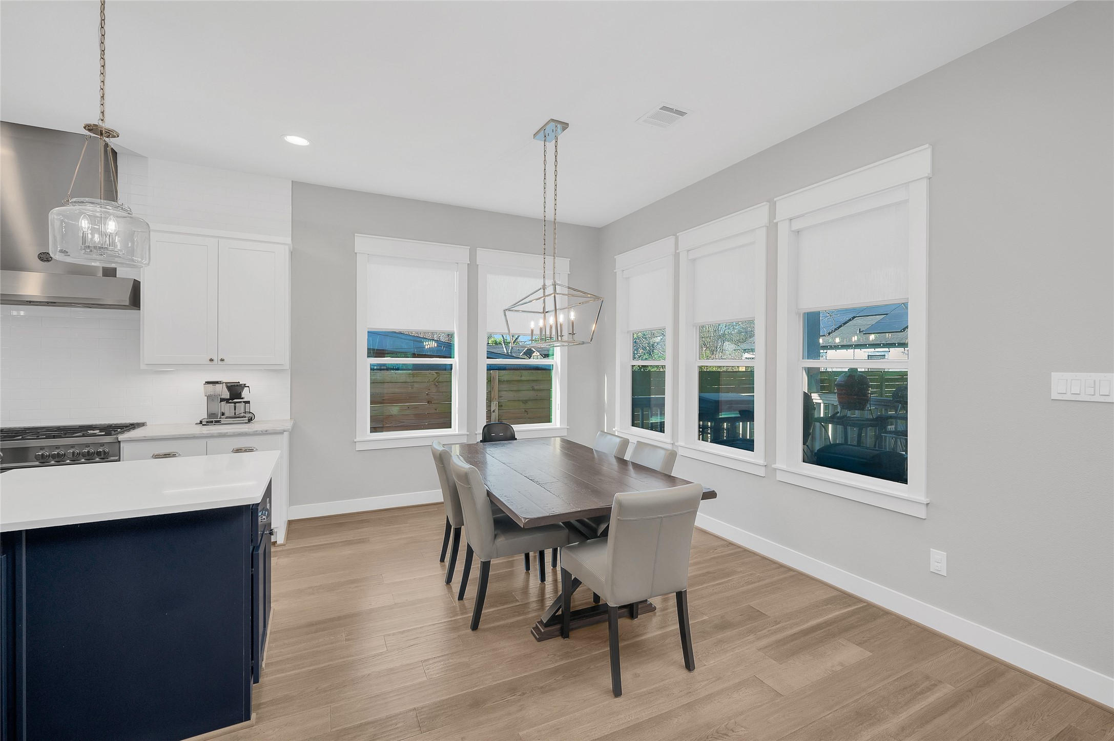 603 Vincent Street Houston, TX 77009 - Photo 6 of 26 Open concept living w/designated dining space + beautiful chandelier + window which overlooks the covered patio + fantastic back green space.