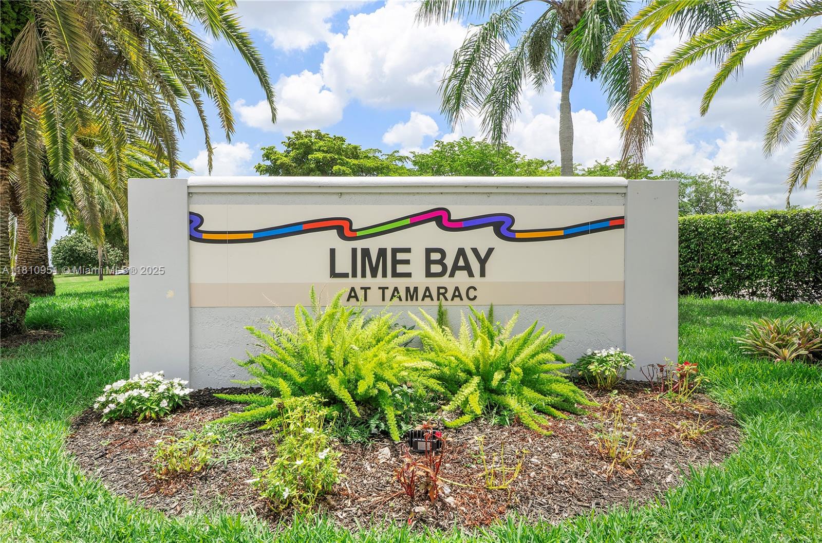 9091 Lime Bay Boulevard, Unit 110 Tamarac, FL 33321 - Photo 1 of 40 a sign that is on the side of the grass