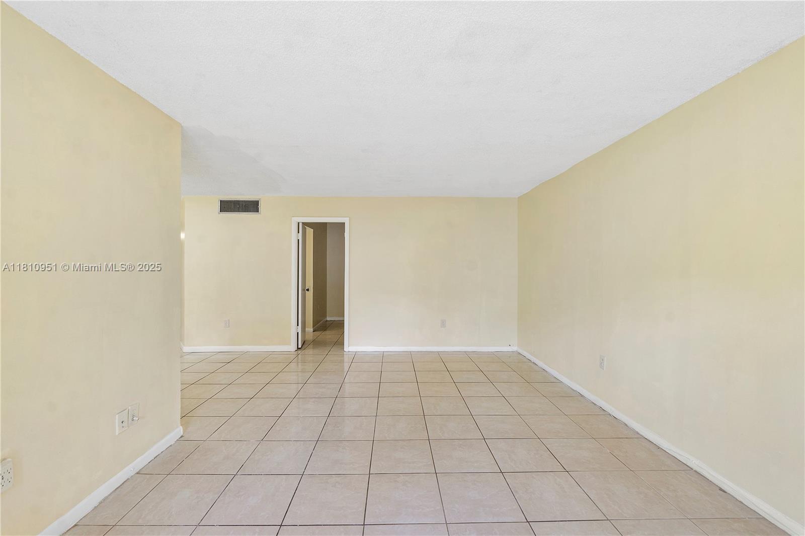 9091 Lime Bay Boulevard, Unit 110 Tamarac, FL 33321 - Photo 17 of 40 a view of an empty room and window