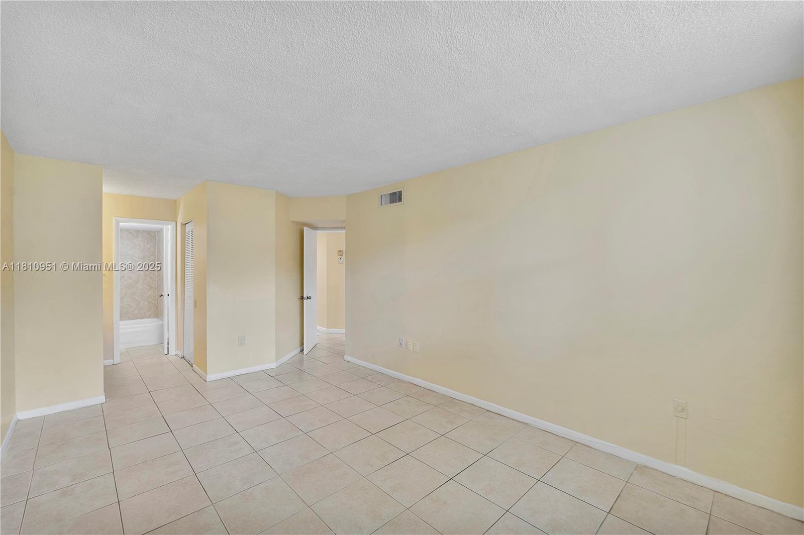 9091 Lime Bay Boulevard, Unit 110 Tamarac, FL 33321 - Photo 22 of 40 a view of an empty room
