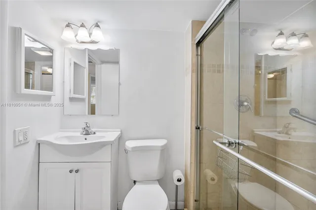 a bathroom with a toilet and shower