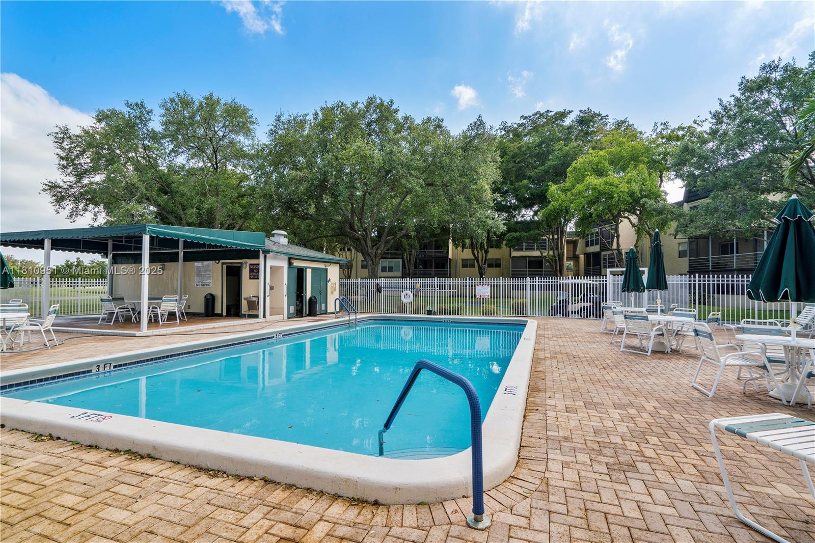 9091 Lime Bay Boulevard, Unit 110 Tamarac, FL 33321 - Photo 29 of 40 a view of swimming pool with chairs