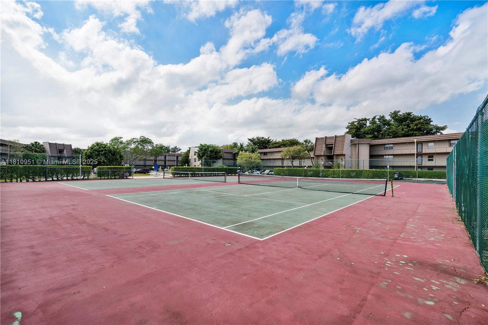 9091 Lime Bay Boulevard, Unit 110 Tamarac, FL 33321 - Photo 30 of 40 a view of a tennis court