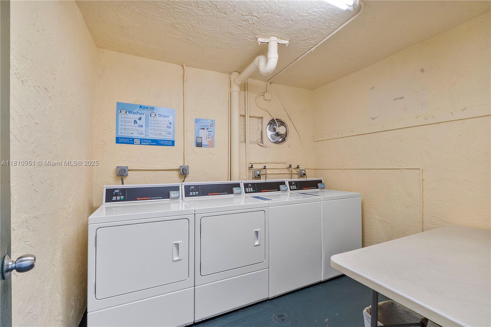 9091 Lime Bay Boulevard, Unit 110 Tamarac, FL 33321 - Photo 32 of 40 a view of cabinets with wooden floor