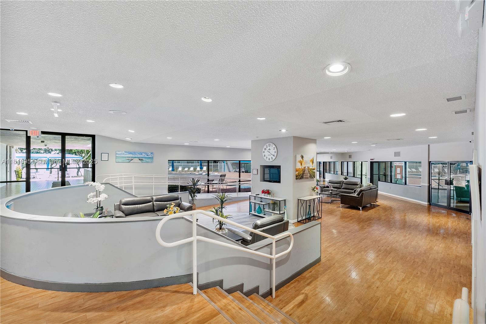 9091 Lime Bay Boulevard, Unit 110 Tamarac, FL 33321 - Photo 33 of 40 a living room with furniture and a flat screen tv