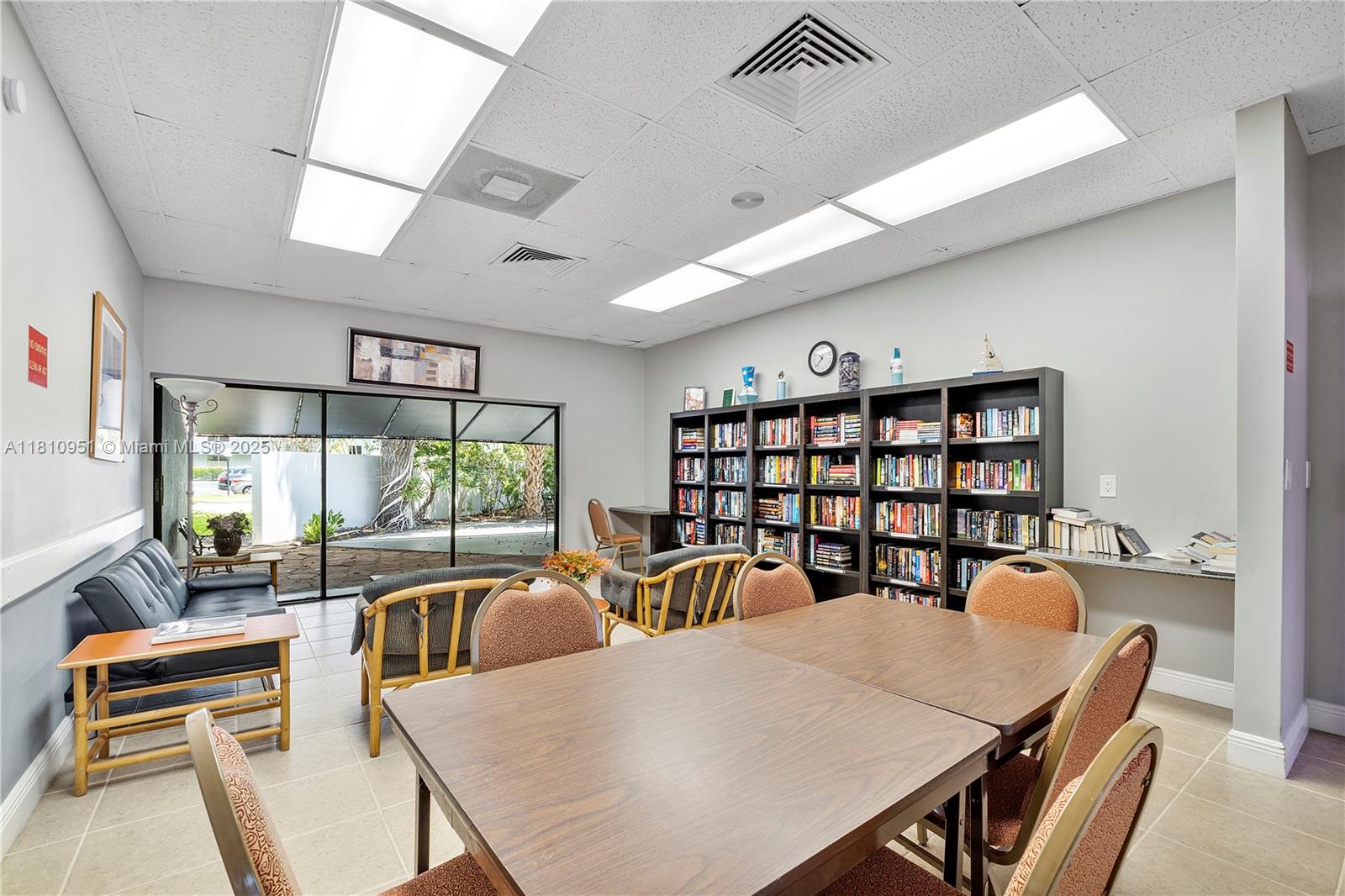 9091 Lime Bay Boulevard, Unit 110 Tamarac, FL 33321 - Photo 35 of 40 a view of a dining room with furniture window and outside view