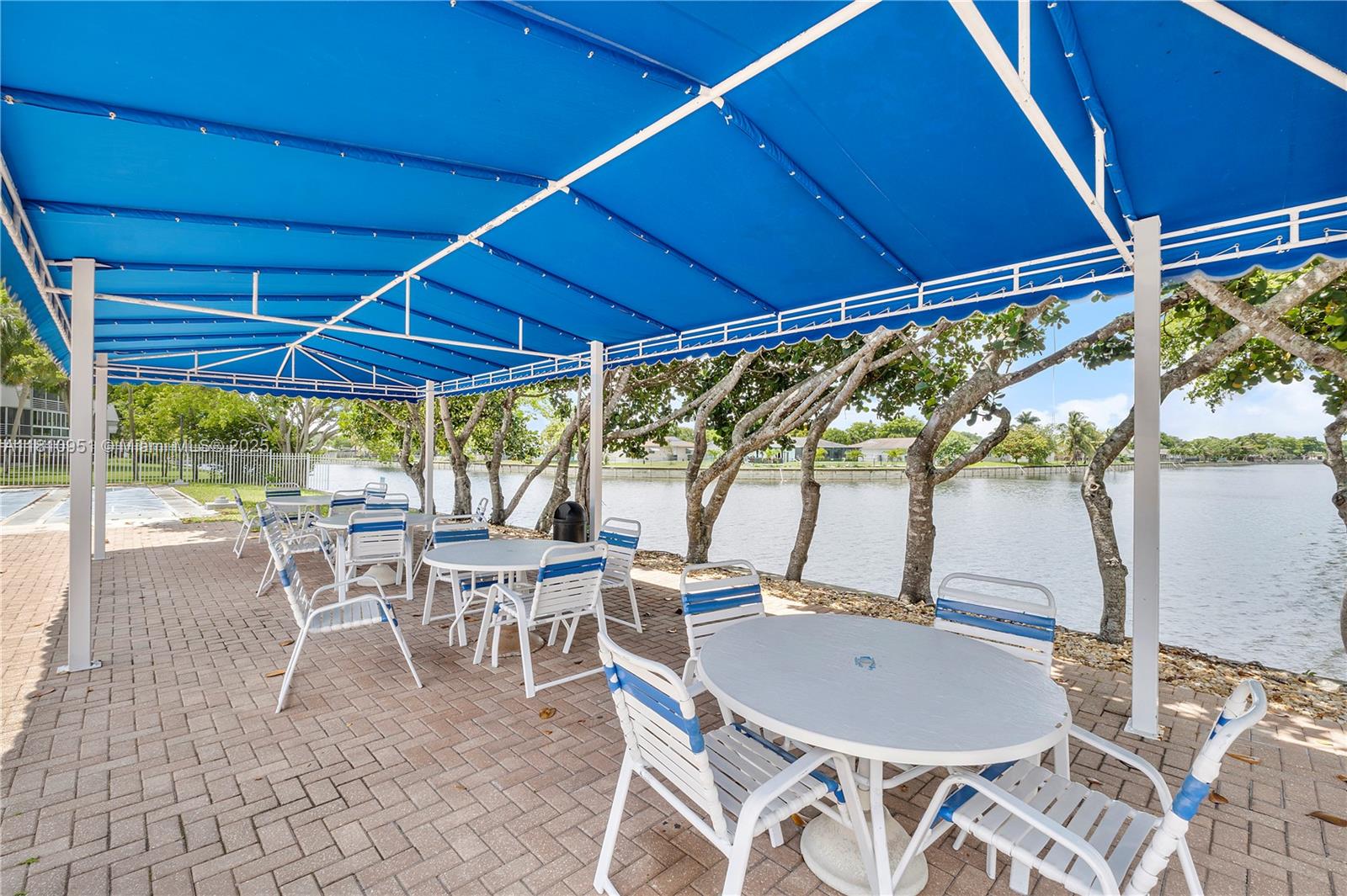 9091 Lime Bay Boulevard, Unit 110 Tamarac, FL 33321 - Photo 38 of 40 a view of a dining room with furniture window and outside view