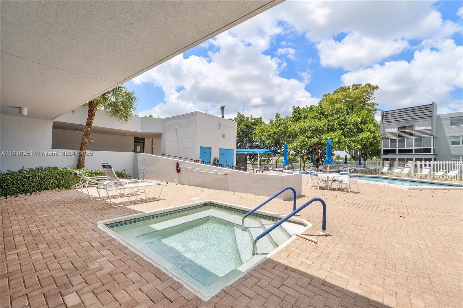 9091 Lime Bay Boulevard, Unit 110 Tamarac, FL 33321 - Photo 40 of 40 a view of a swimming pool with a patio