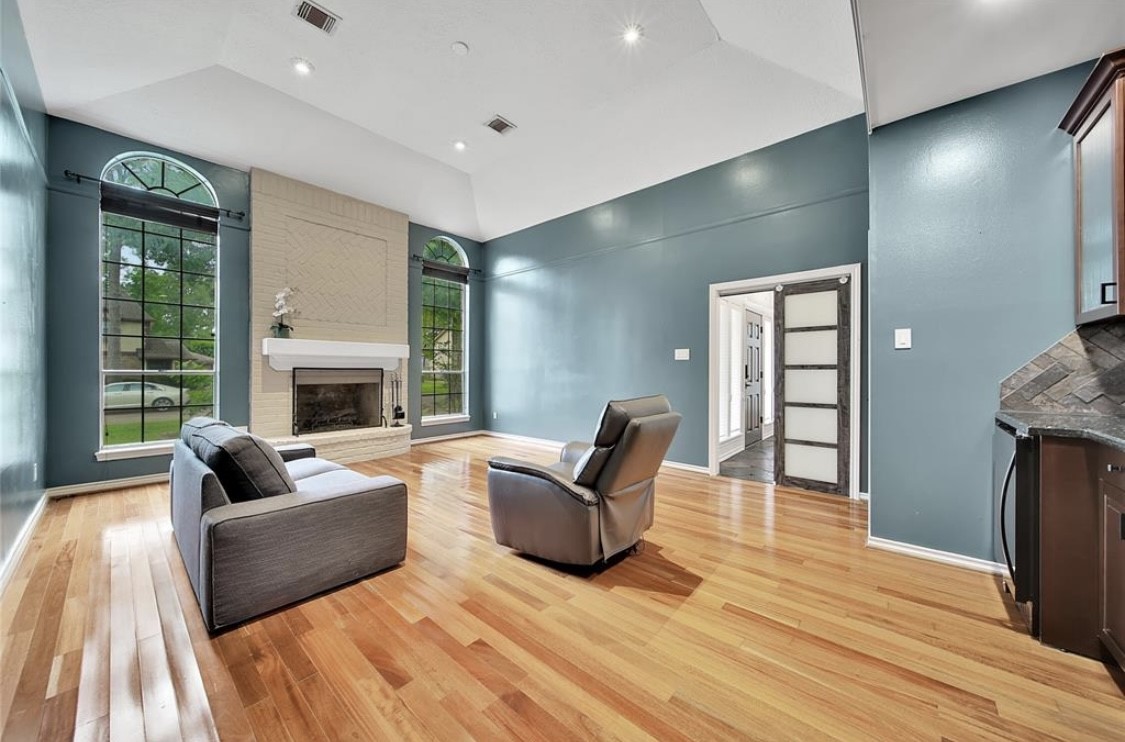 12922 Lentando Drive Cypress, TX 77429 - Photo 15 of 41 a living room with furniture and a fireplace