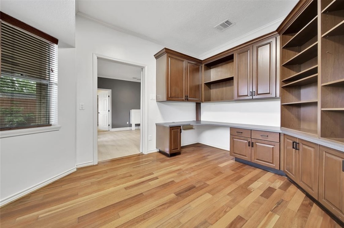 12922 Lentando Drive Cypress, TX 77429 - Photo 17 of 41 a kitchen with wooden cabinets and center sink