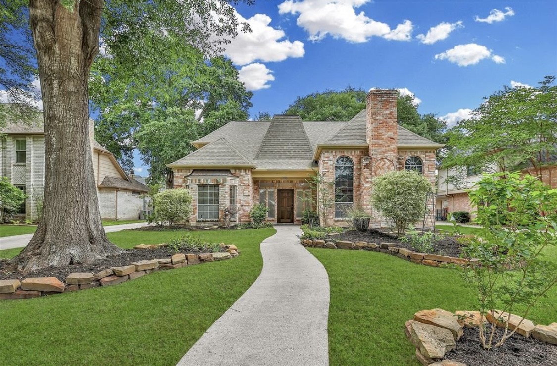 12922 Lentando Drive Cypress, TX 77429 - Photo 2 of 41 a front view of house with a garden and patio