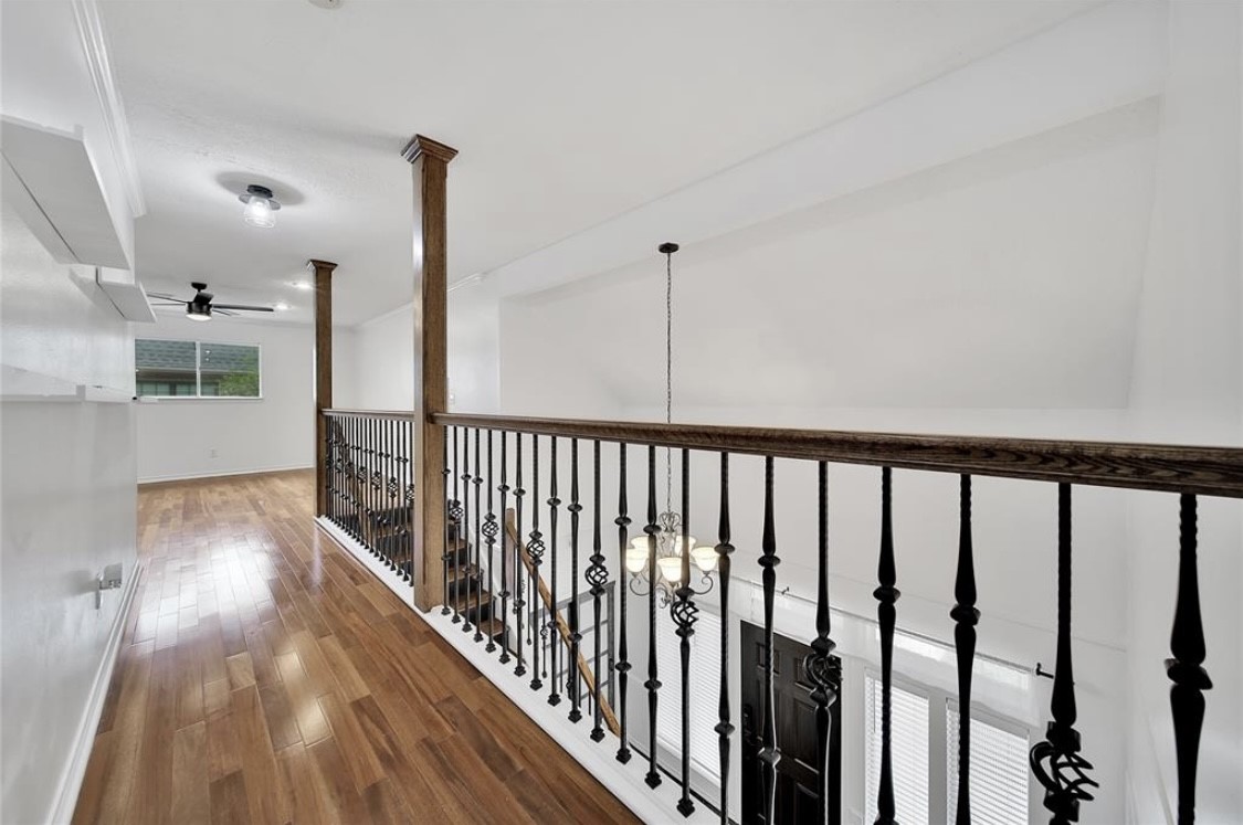 12922 Lentando Drive Cypress, TX 77429 - Photo 24 of 41 a view of a hallway with wooden floor