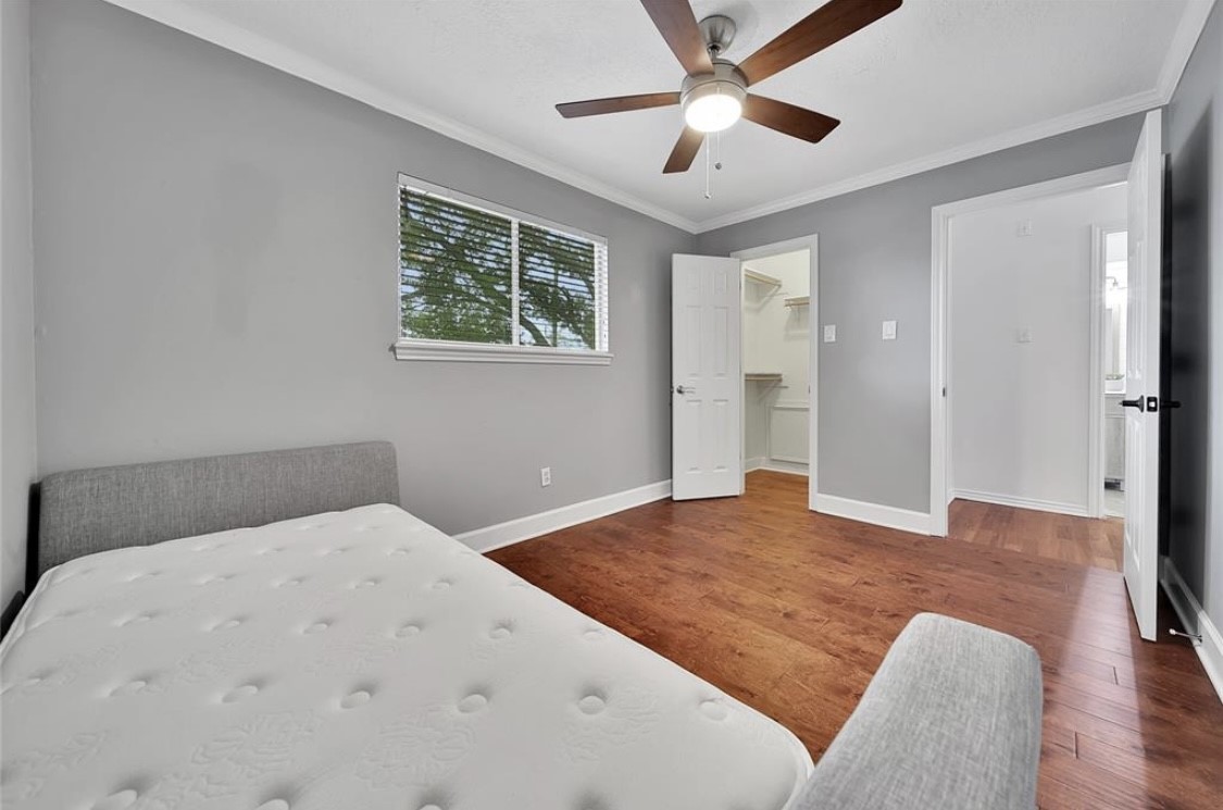 12922 Lentando Drive Cypress, TX 77429 - Photo 26 of 41 a bedroom with a large bed and a window