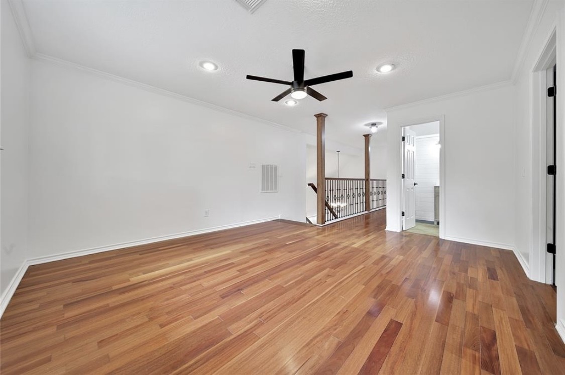 12922 Lentando Drive Cypress, TX 77429 - Photo 29 of 41 a view of empty room with wooden floor and ceiling fan