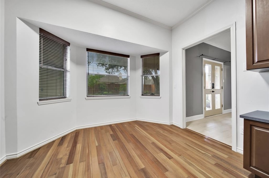 12922 Lentando Drive Cypress, TX 77429 - Photo 33 of 41 a view of empty room with wooden floor and fan