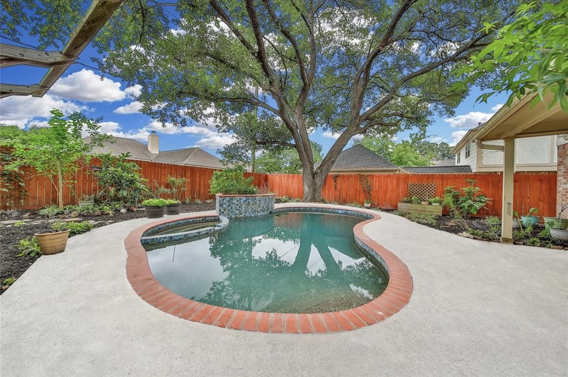 12922 Lentando Drive Cypress, TX 77429 - Photo 35 of 41 a view of a swimming pool with a yard