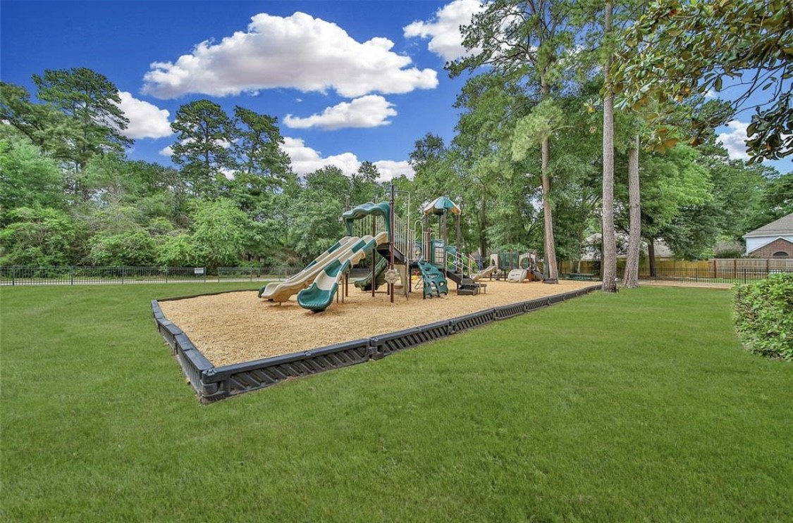 12922 Lentando Drive Cypress, TX 77429 - Photo 38 of 41 a view of a park with swings and a bench