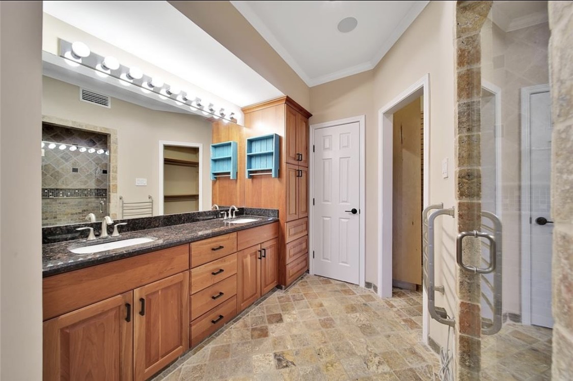 12922 Lentando Drive Cypress, TX 77429 - Photo 6 of 41 a spacious bathroom with a granite countertop sink mirror and shower