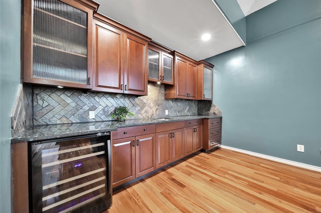 12922 Lentando Drive Cypress, TX 77429 - Photo 10 of 41 a kitchen with stainless steel appliances granite countertop cabinets and wooden floor