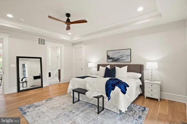 a bed room with a bed and a chandelier