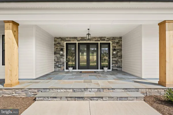 a view of a livingroom with wooden floor and a window