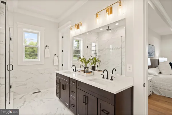 a bathroom with a sink double vanity and a mirror