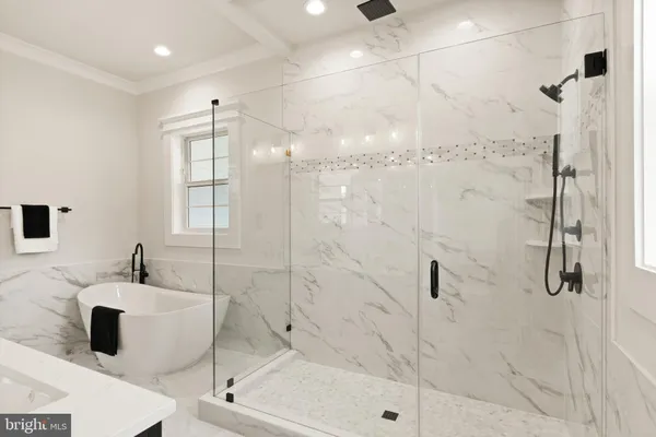 a bathroom with a shower and a sink