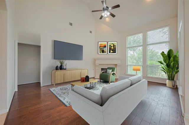 a living room with furniture and a flat screen tv