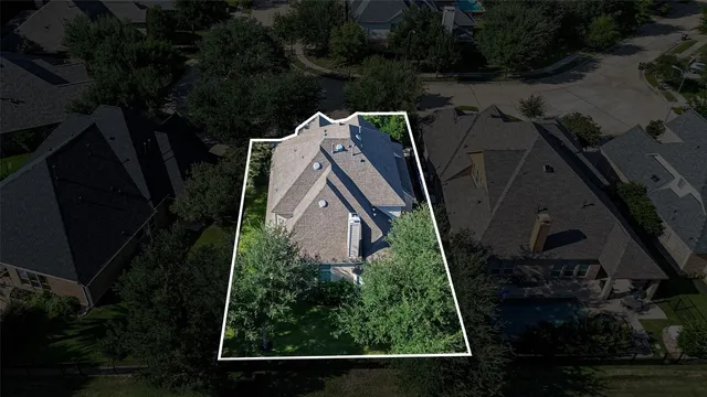 an aerial view of a house having yard