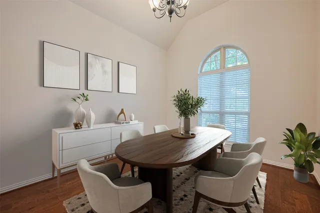 a dining room with furniture and wooden floor