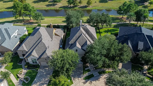 an aerial view of house with yard swimming pool and outdoor seating