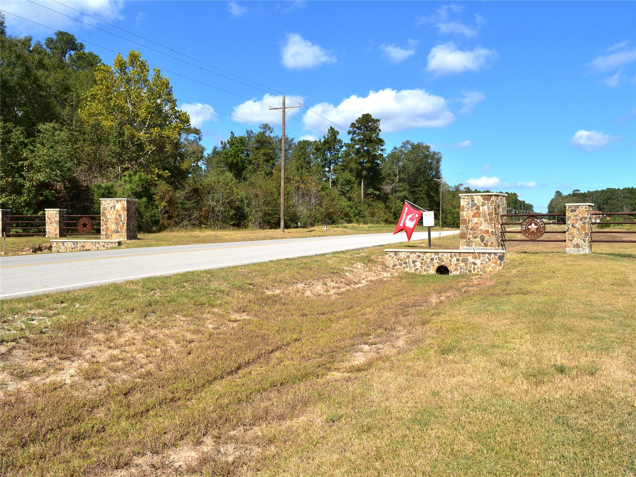 Tbd Copperleaf Road Huntsville, TX 77340 - Photo 21 of 24 a view of a swimming pool with an outdoor space and seating area