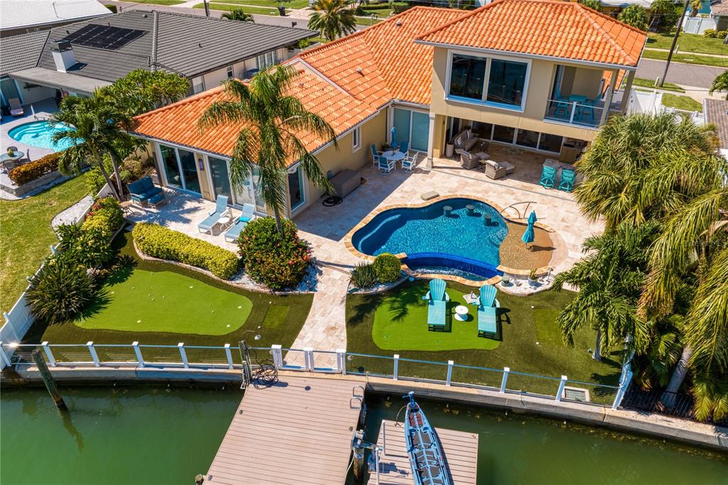 321 Palm Island Southeast Clearwater, FL 33767 - Photo 1 of 88 an aerial view of a house with a garden and lake view