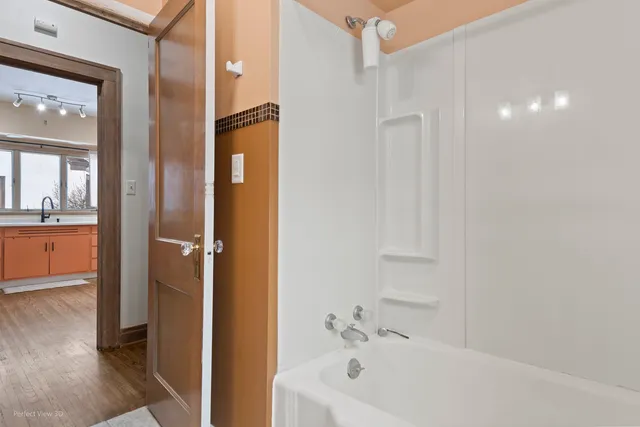 a bathroom with a bathtub and a sink