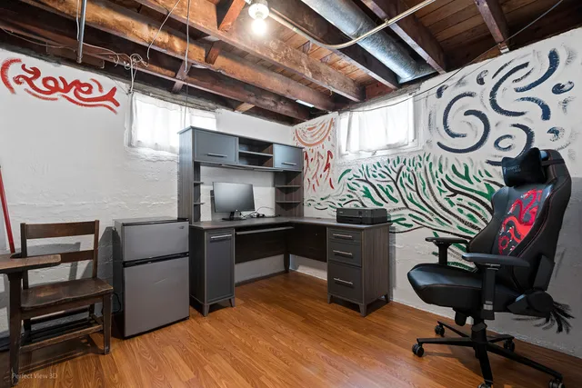 a kitchen with a refrigerator and a stove top oven