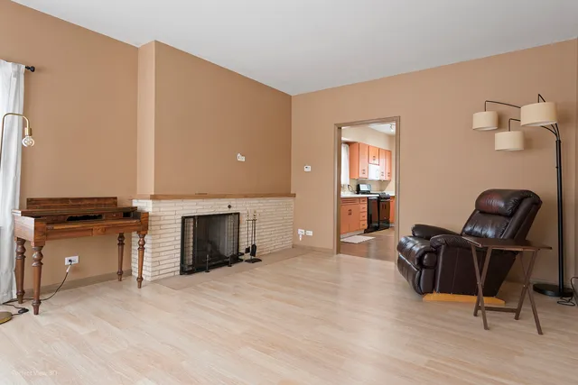 a view of a livingroom with furniture and a fireplace