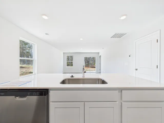 a kitchen with a sink and cabinets