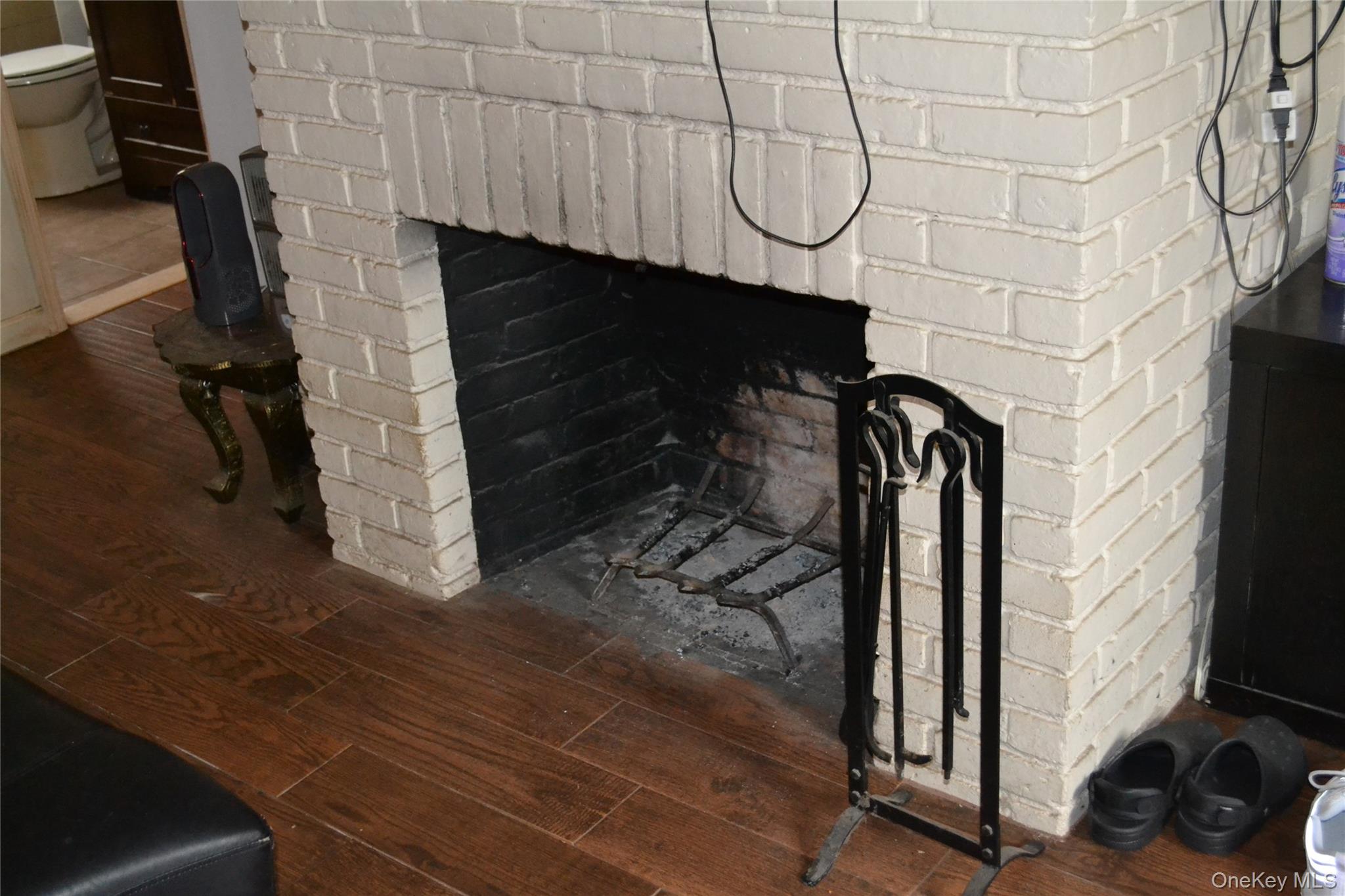 516 Long Beach Road Island Park, NY 11558 - Photo 17 of 31 Main house fireplace