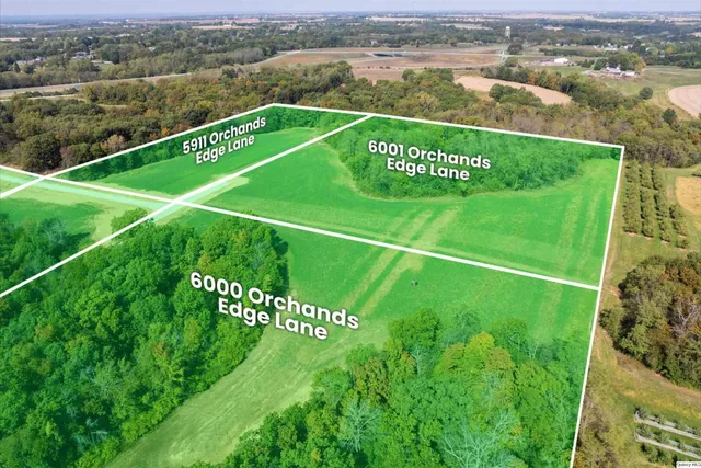 a sign that is sitting on a lush green field