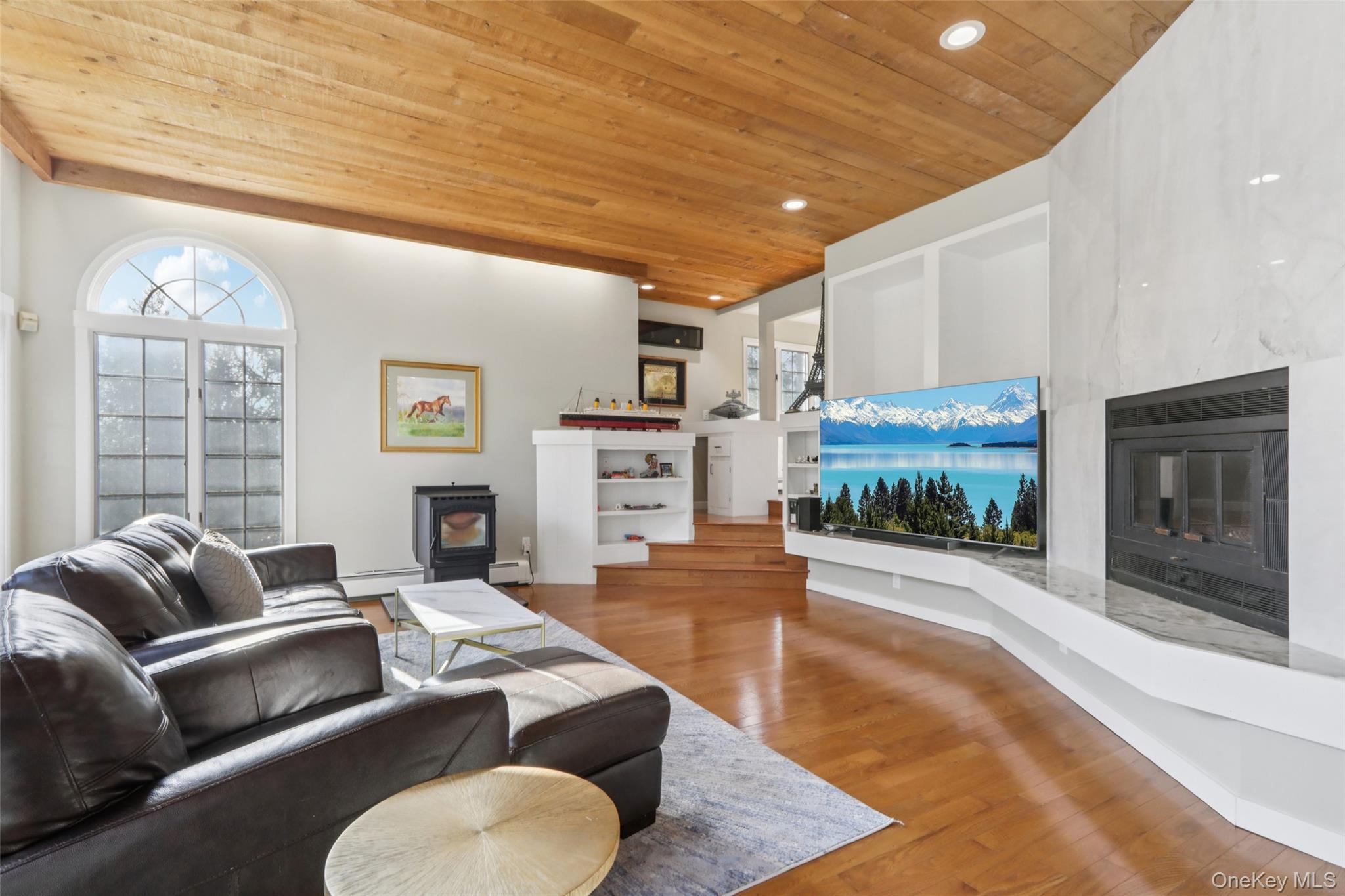 27 Cat Ridge Road North Salem, NY 10560 - Photo 13 of 46 a living room with furniture a fireplace and a large window