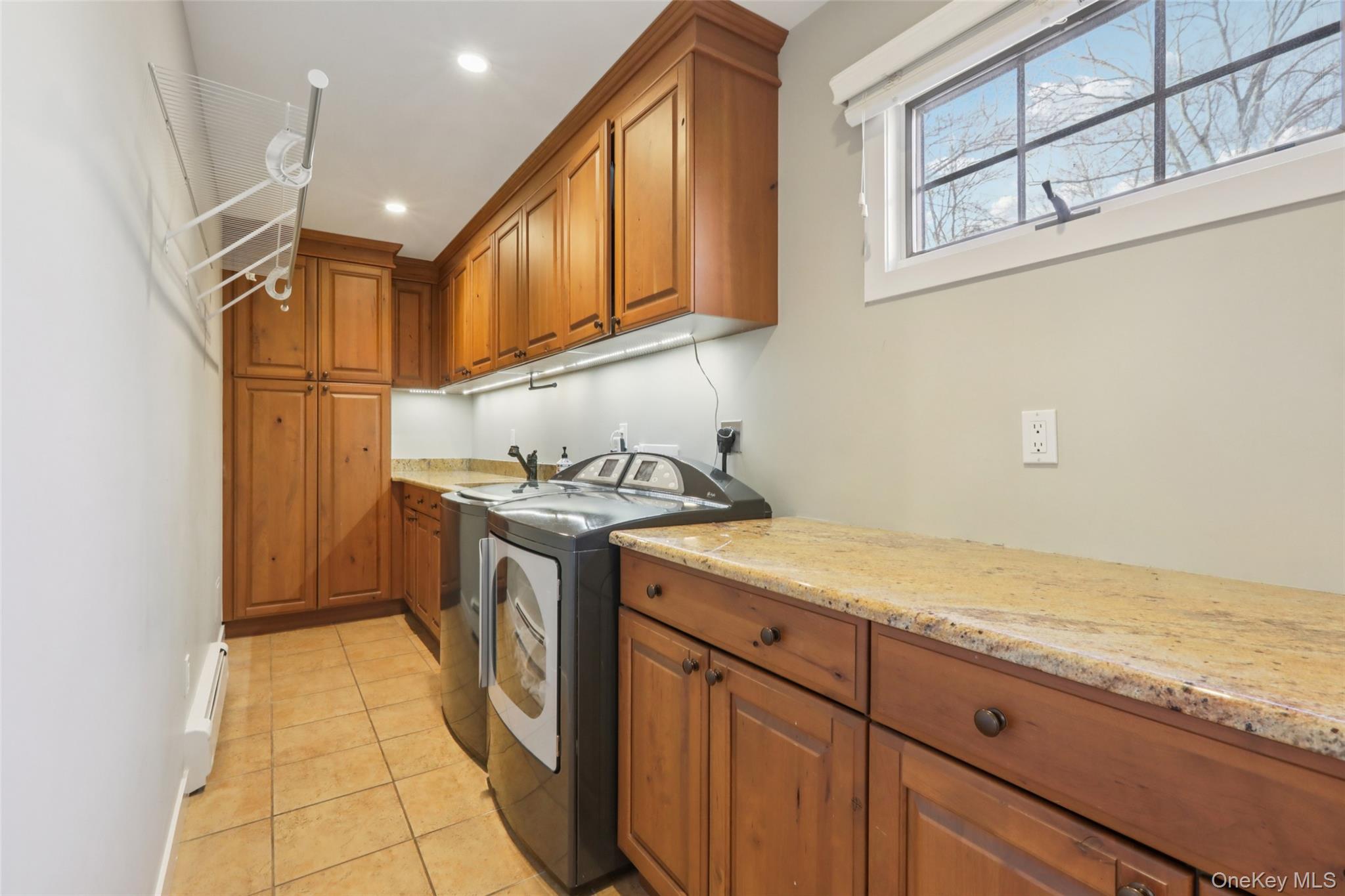 27 Cat Ridge Road North Salem, NY 10560 - Photo 25 of 46 a utility room with granite countertop a sink a washer and dryer