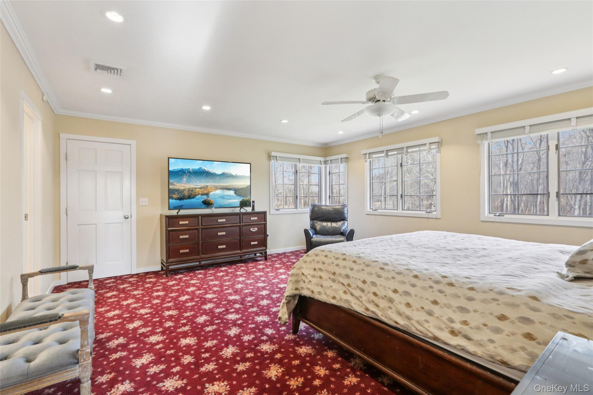 27 Cat Ridge Road North Salem, NY 10560 - Photo 32 of 46 a bedroom with a large bed and a flat screen tv