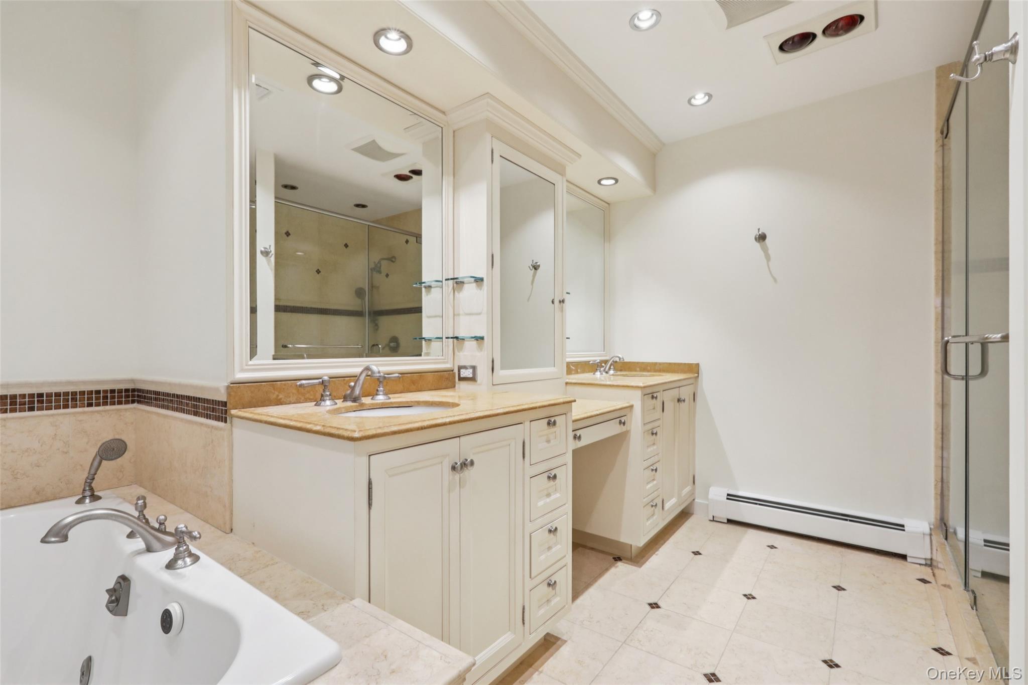 27 Cat Ridge Road North Salem, NY 10560 - Photo 34 of 46 Full bath with a whirlpool tub, two vanities, a baseboard heating unit, a shower stall, and recessed lighting