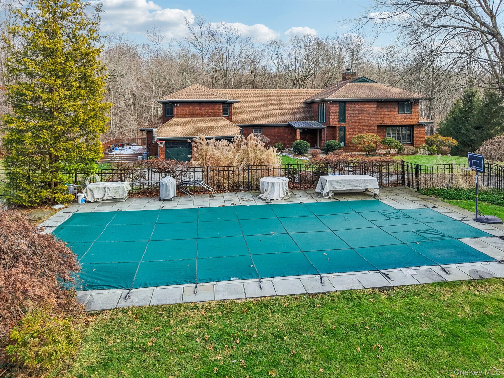 27 Cat Ridge Road North Salem, NY 10560 - Photo 37 of 45 a front view of a house with a yard table and chairs