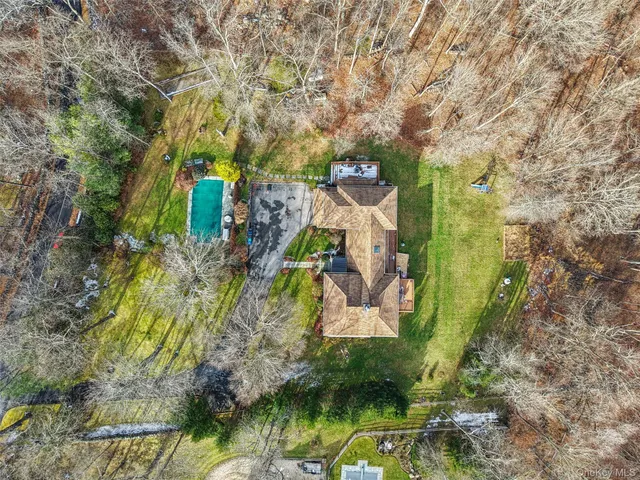 a backyard of a house with outdoor seating and yard