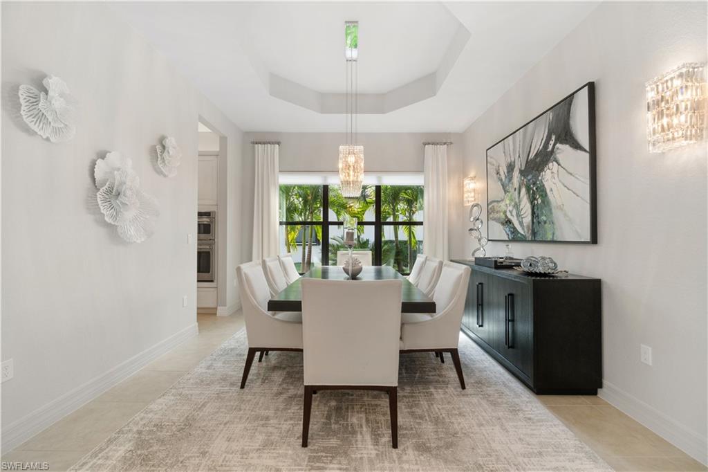 4467 Caldera Circle Naples, FL 34119 - Photo 15 of 50 a dining room with furniture and window