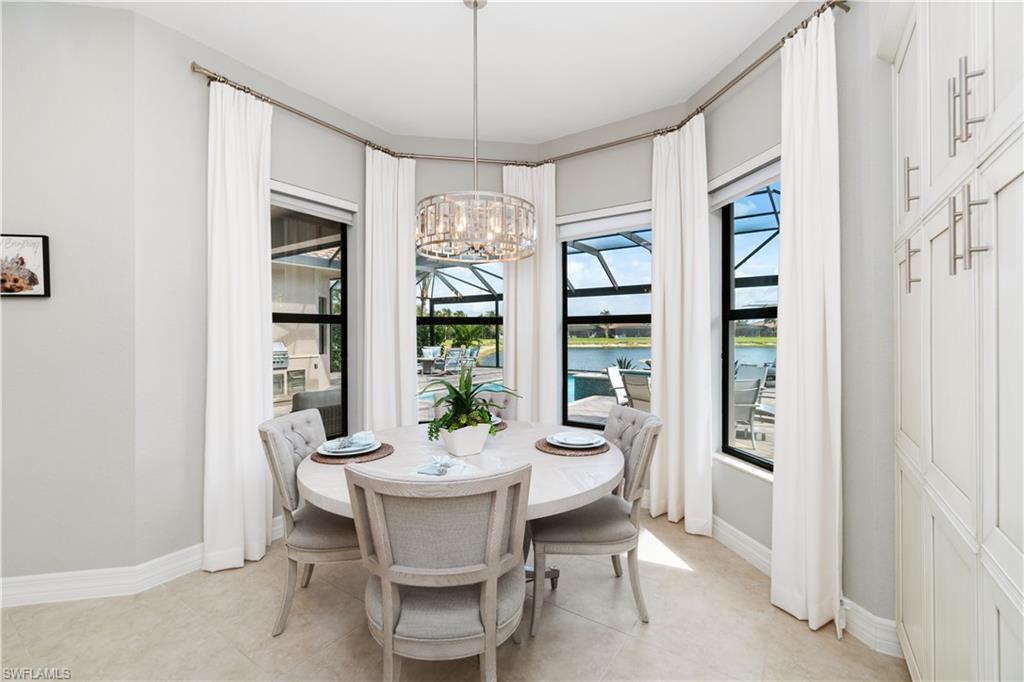 4467 Caldera Circle Naples, FL 34119 - Photo 21 of 50 a dining room with furniture and window