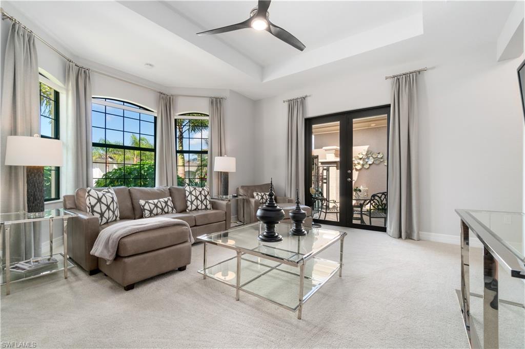 4467 Caldera Circle Naples, FL 34119 - Photo 25 of 50 a living room with furniture and a large window