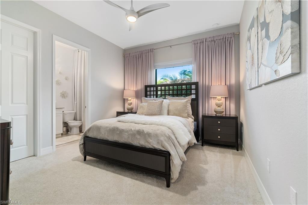 4467 Caldera Circle Naples, FL 34119 - Photo 27 of 50 a spacious bedroom with a bed and a window